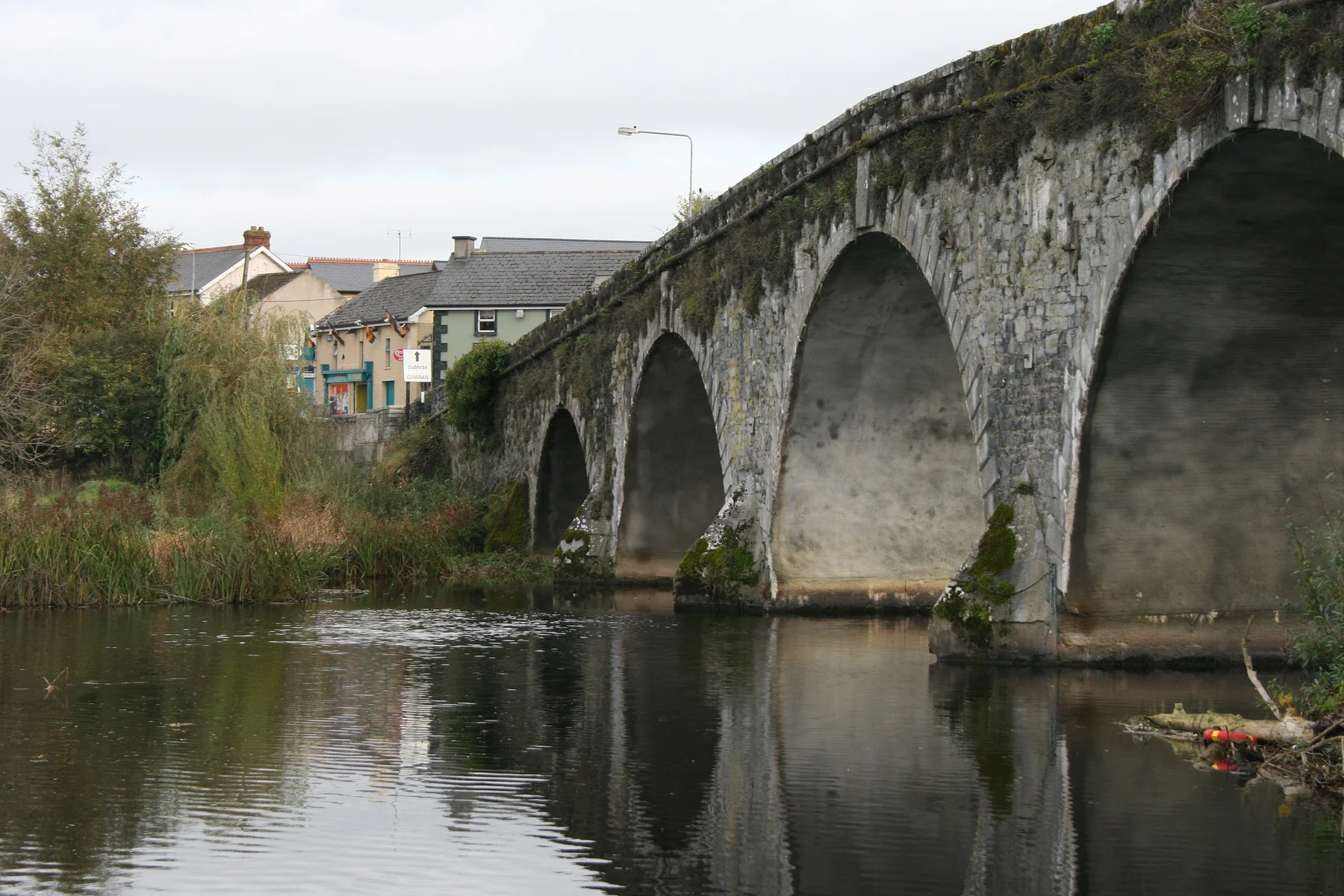Stone arches of Bennettsbridge reflected in the River Nore, archive photograph by Sarah777, October 2007